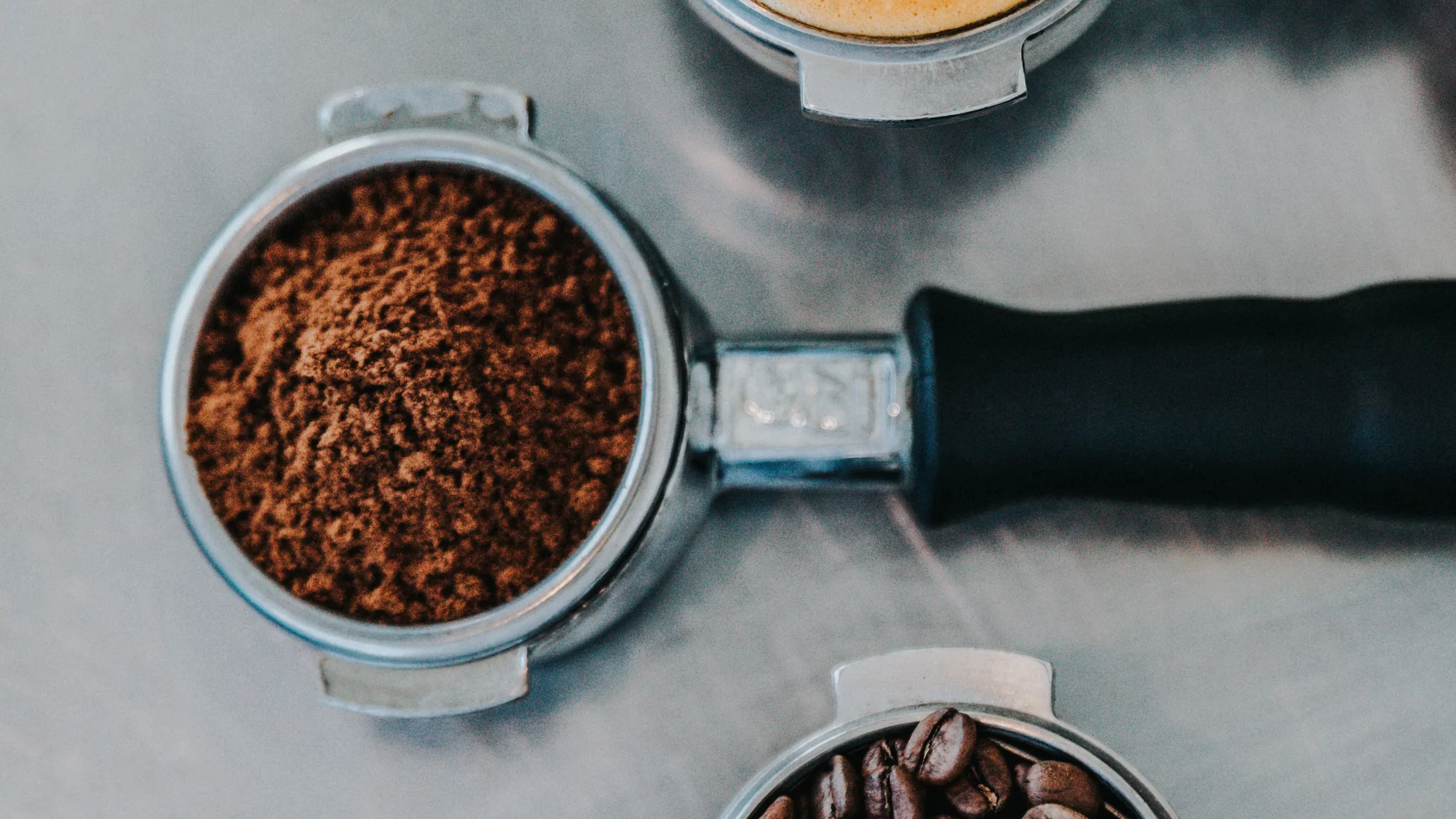 Lowtide campaign image: espresso, ground coffee and beans from above